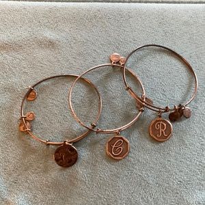 Alex and ani bracelets 3 total one Scorpio and two in total ones an R and a C